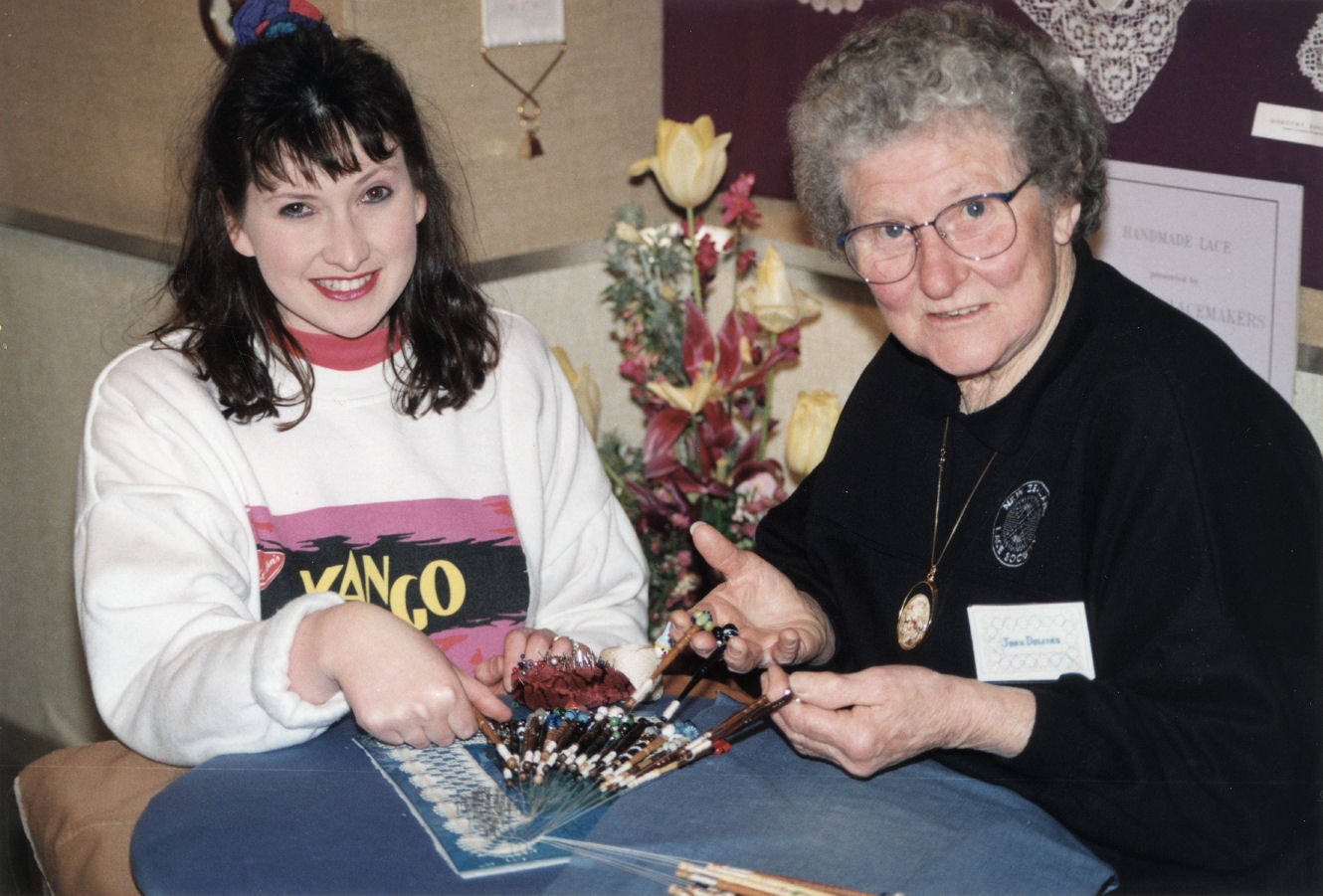 Embroiderers' guild; guest Joan Downes demonstrating lacemaking at Community Gallery exhibition.
