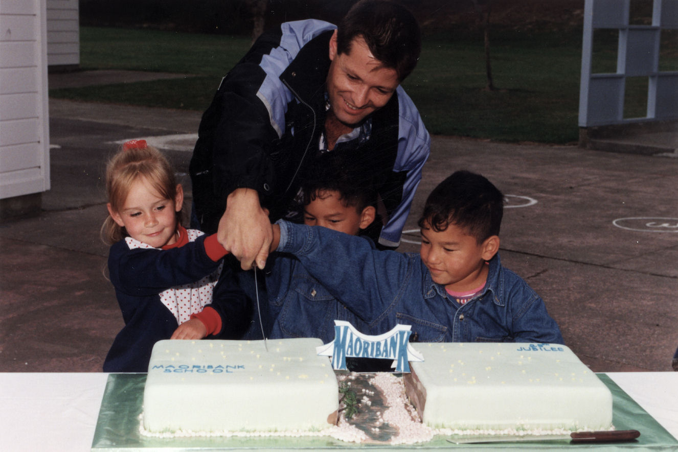 Maoribank School's 25th jubilee; youngest pupils Ashley Mason and Robert and Joseph Tamarapa cut the cakes.