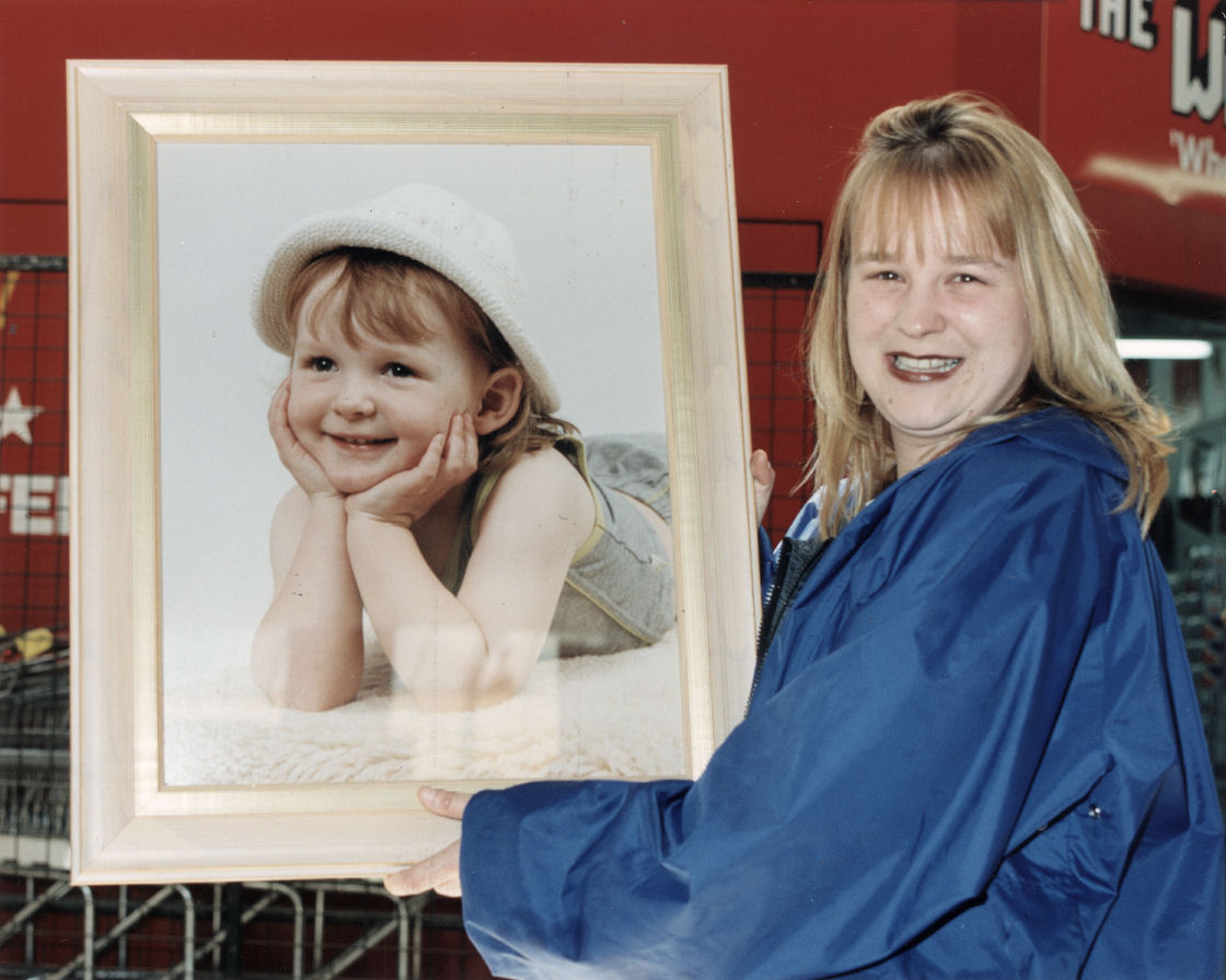 Logan Plaza; Chaplow's baby photo show winner, Mrs Robinson, with framed enlargement of Shantalia.