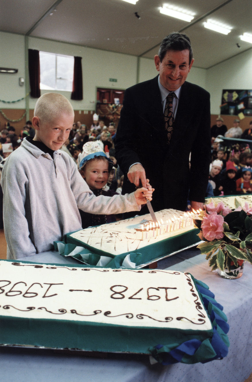 Birchville School 20th birthday; cake cut by Minister of Finance Bill Birch, with Sophie Rattray, Willie Mangin.
