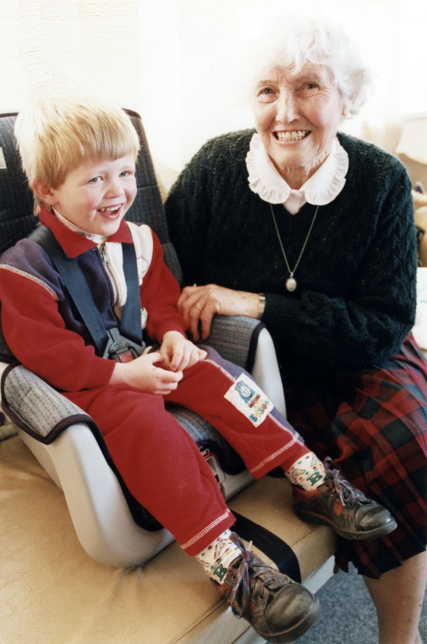 WDFF; child seats presented to Plunket; WDFF president Phyllis McPherson and Callum Anderson, almost 3.
