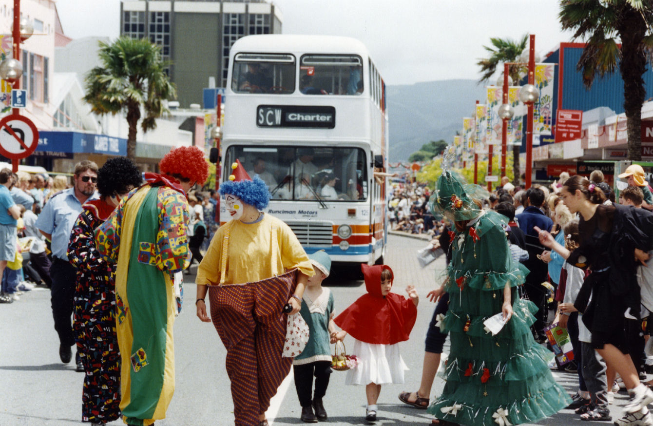 Christmas parade 1998; clowns, double-decker bus.