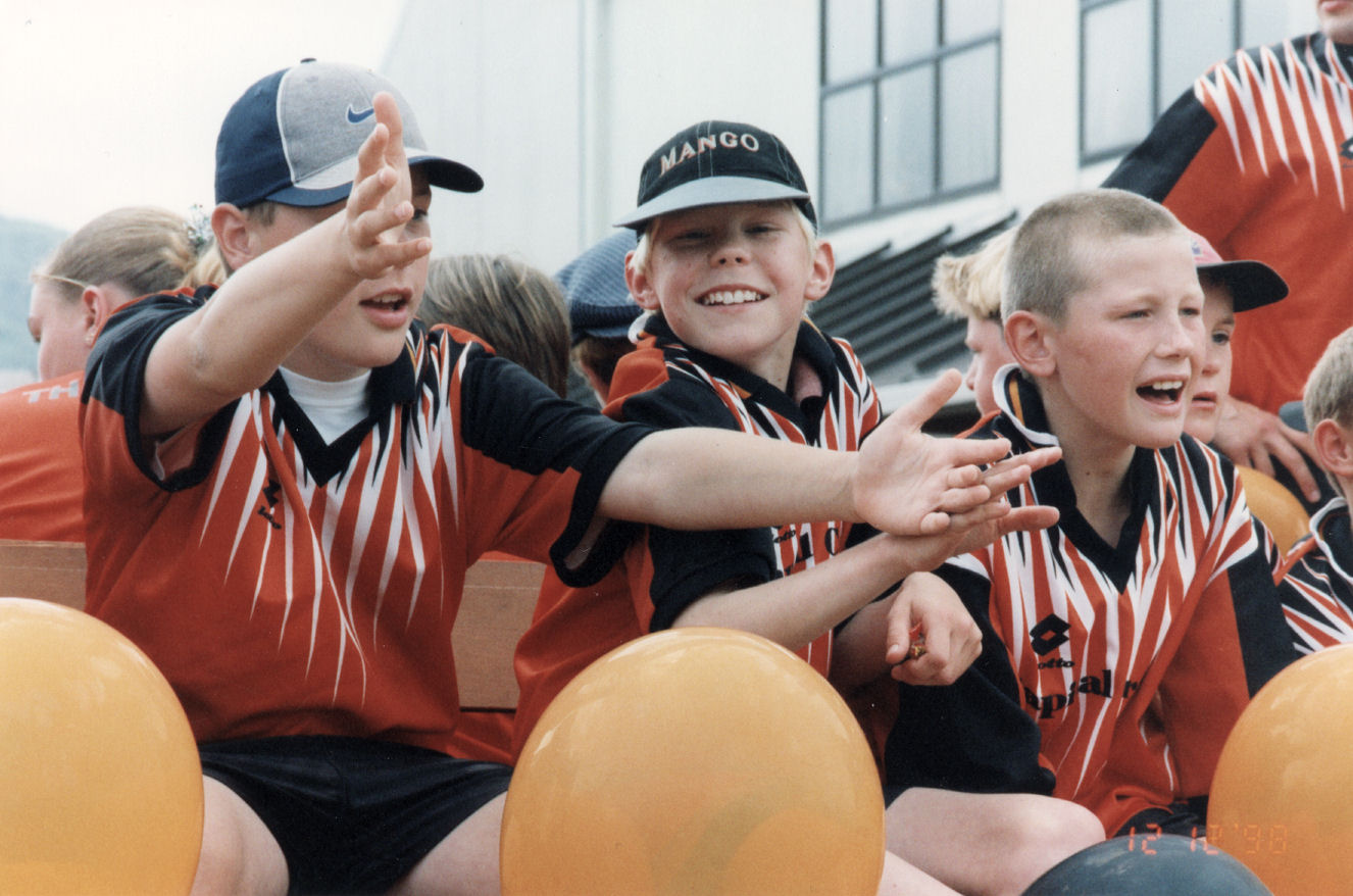 Christmas parade 1998; boys on float; soccer club?