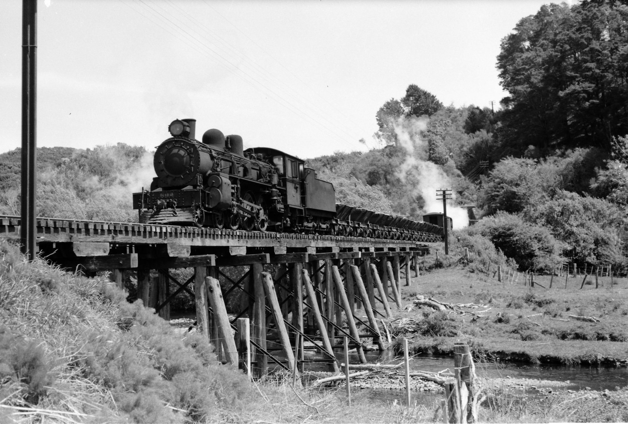 A-class 4-6-2 locomotive No. 604 with train on Mangaroa River bridge - 1953.