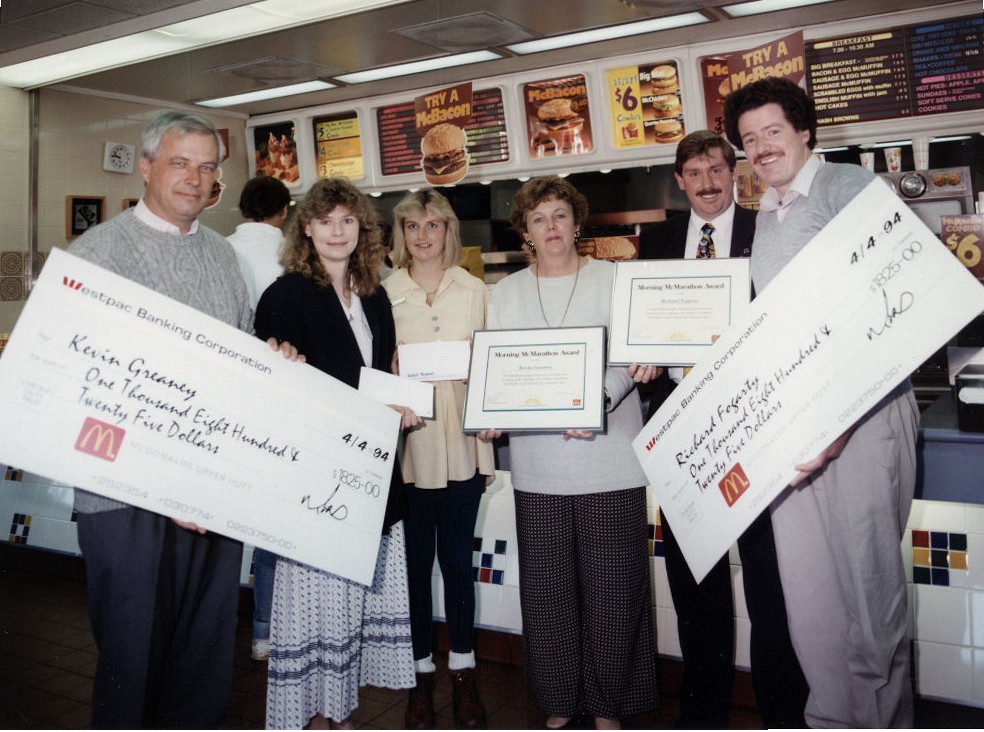 McDonald's; monster cheques; joint winners Kevin Greaney and Richard Fogarty.