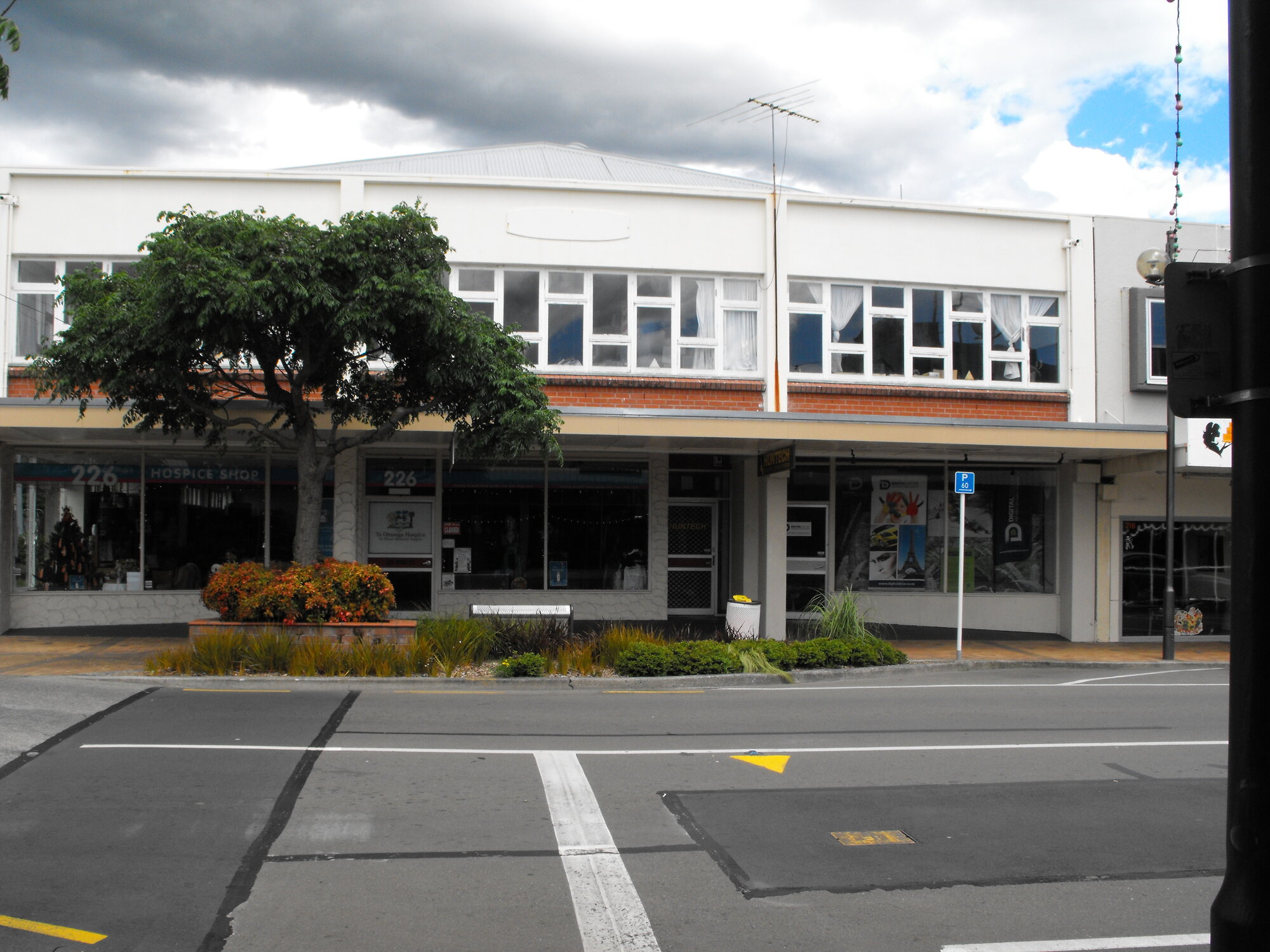 Main Street, south side; No. 218-228; Te Omanga Hospice shop.
