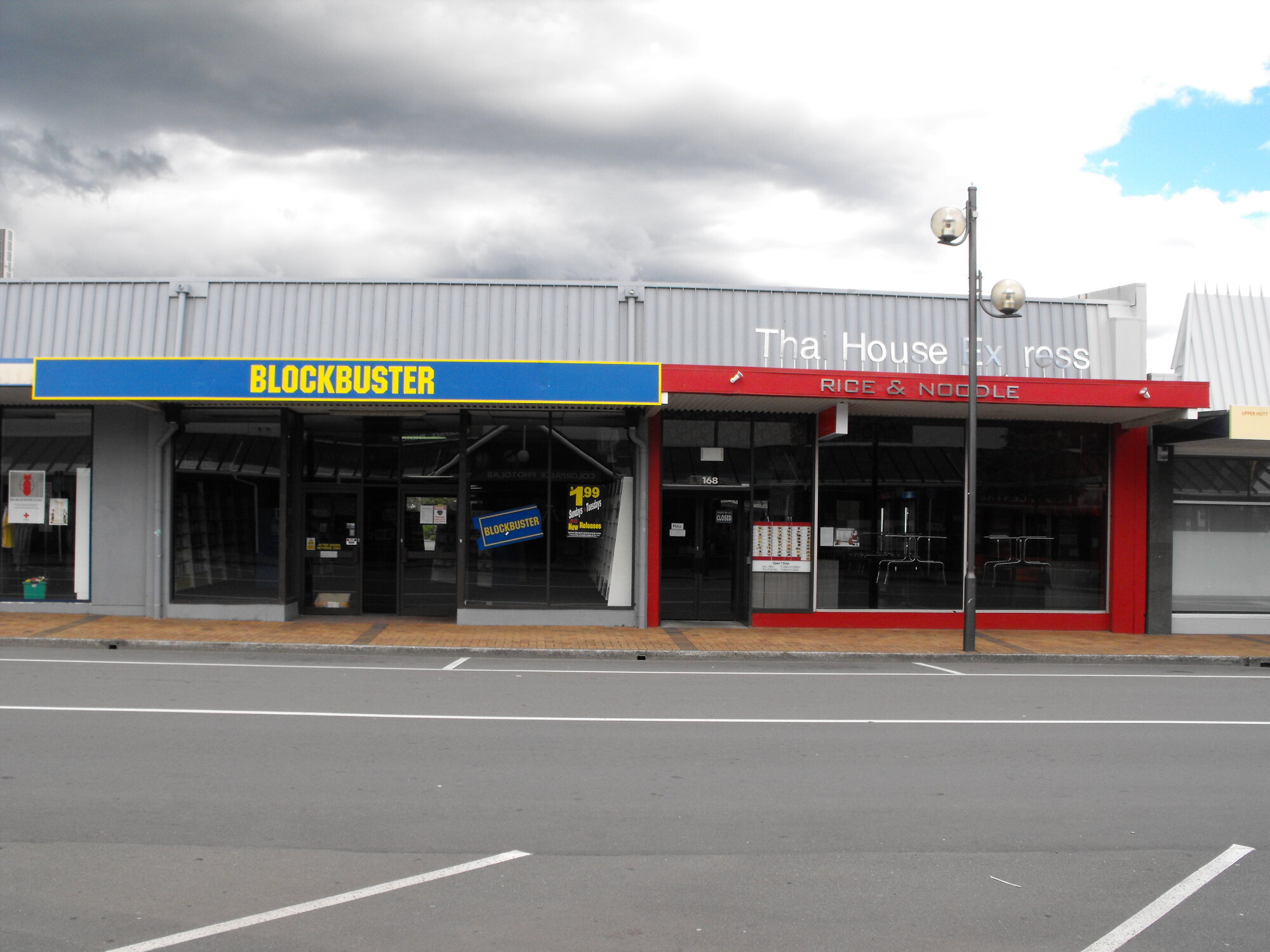 Main Street, south side; No. 166, 168 1; Blockbuster and Thai House Express