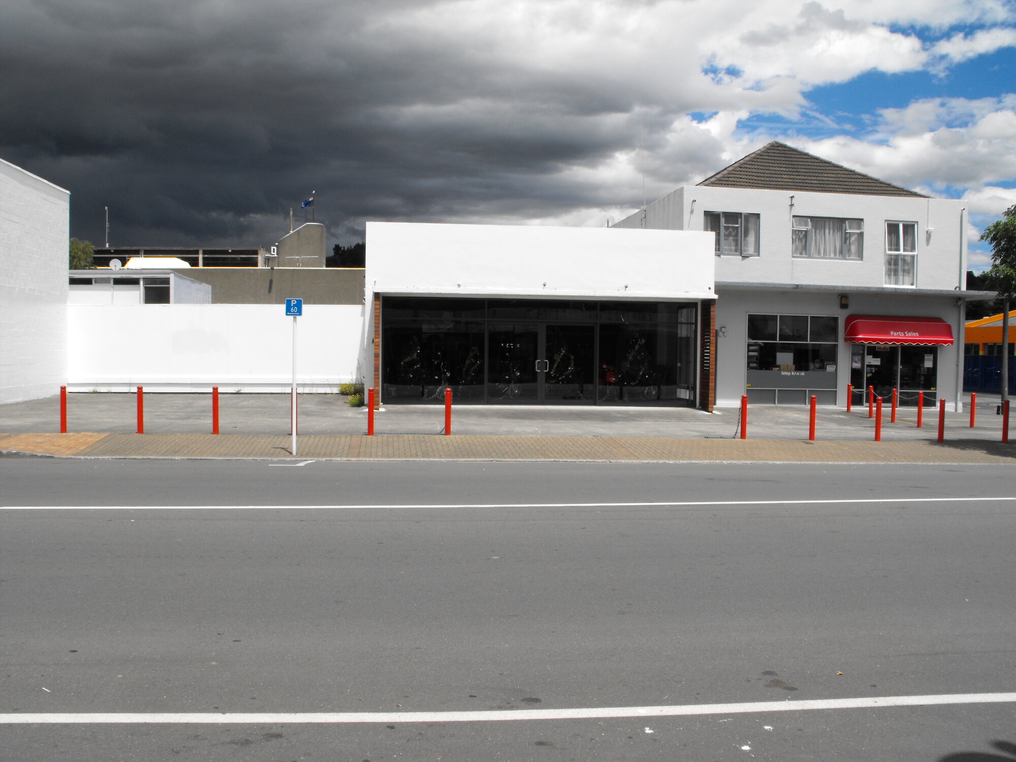 Main Street, south side; No.  58-64; Gethings Mitsubishi