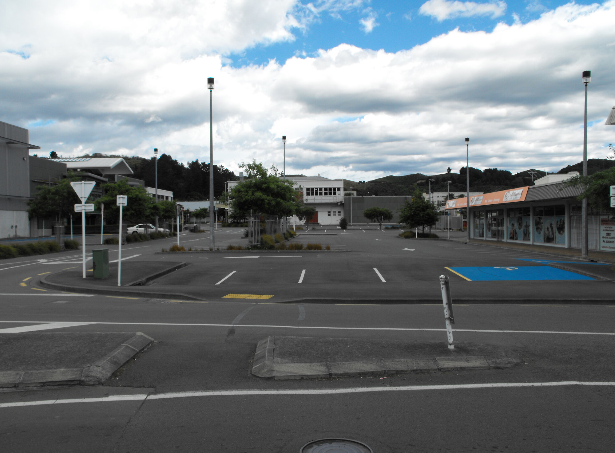 Queen Street, south side; No. 76-82 and Logan Street car parking.