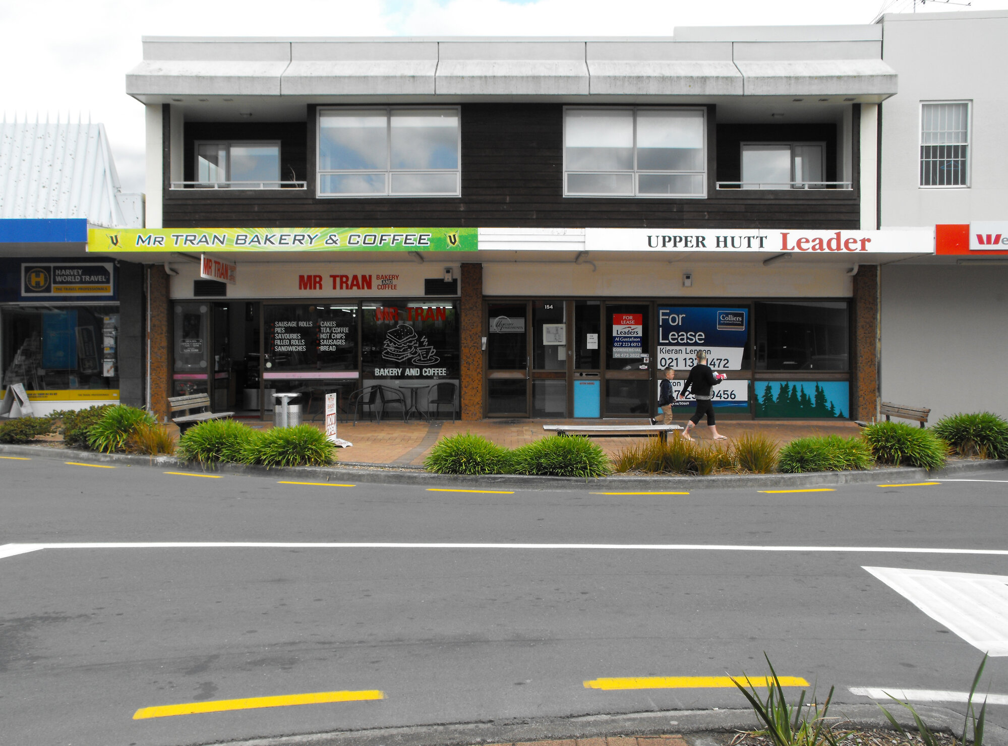Main Street, south side; No. 152-154 2; Mr Tran Bakery and Coffee, left; Mercury Apartments above.