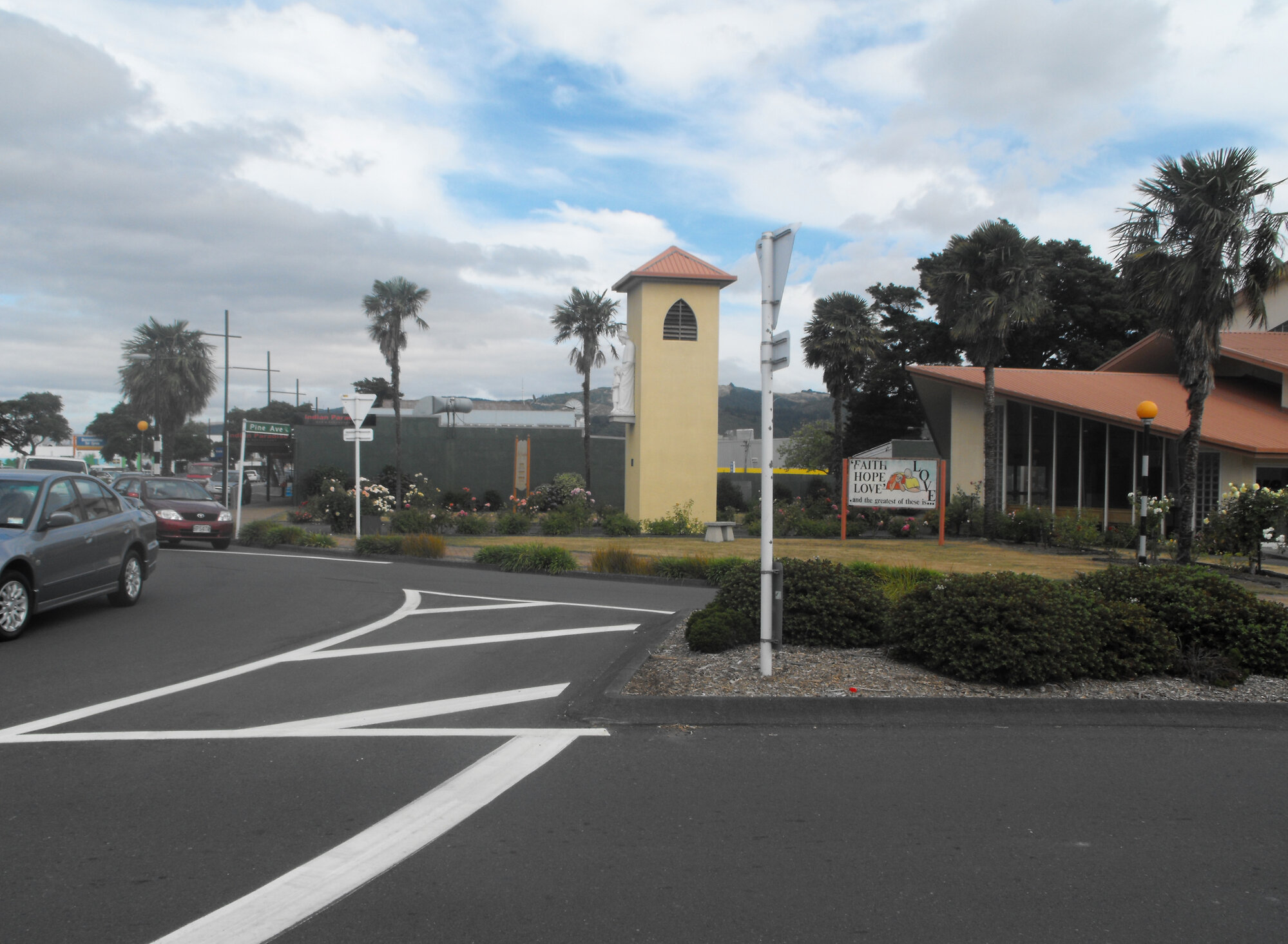 Pine Avenue west side 1; St Joseph's Catholic Church belltower and entry end.