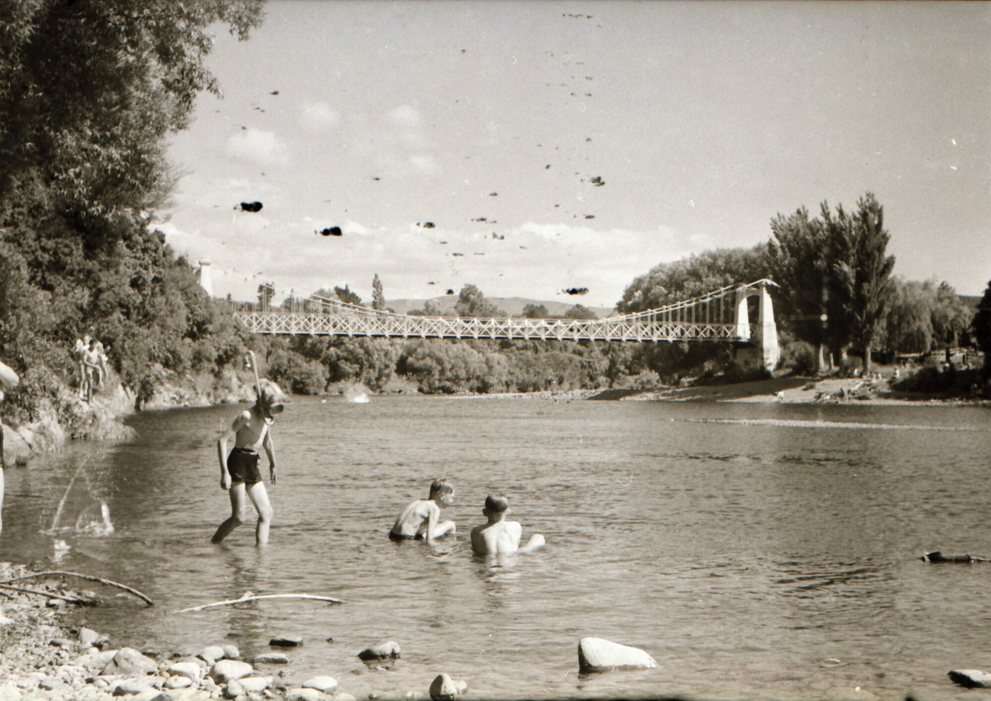 Swimmers in Te Awa Kairangi / Hutt River, upstream from Maoribank suspension bridge.