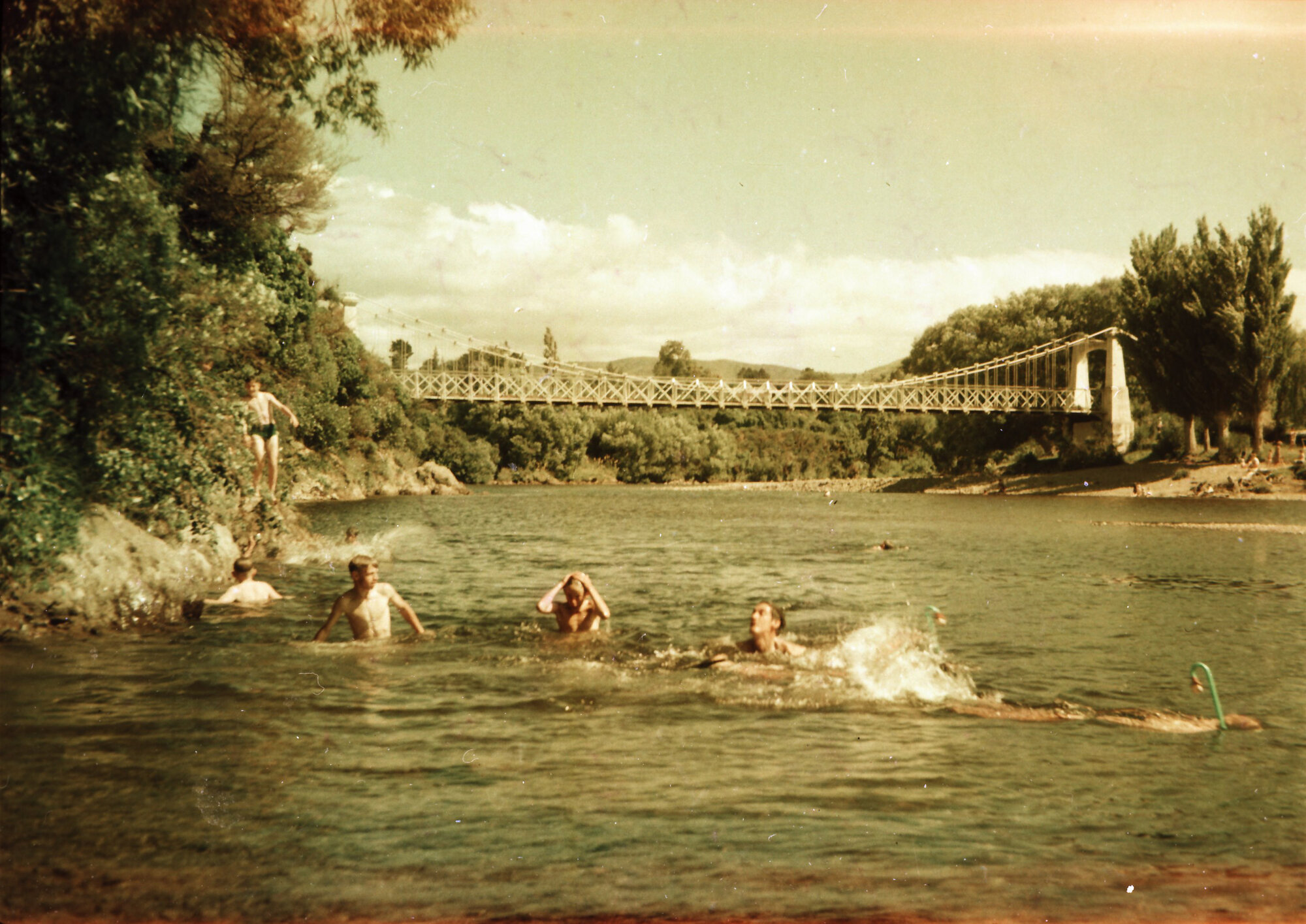 Swimmers in Te Awa Kairangi / Hutt River, upstream from Maoribank suspension bridge.