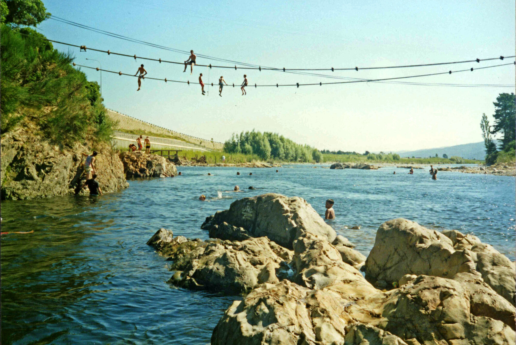 Maoribank; boys jumping from suspension cables of demolished bridge