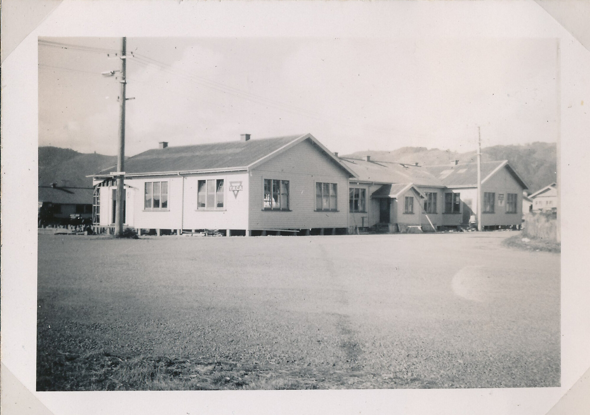 Y.M.C.A Photograph Album Page 18; Being Pieced Back Together After Relocation