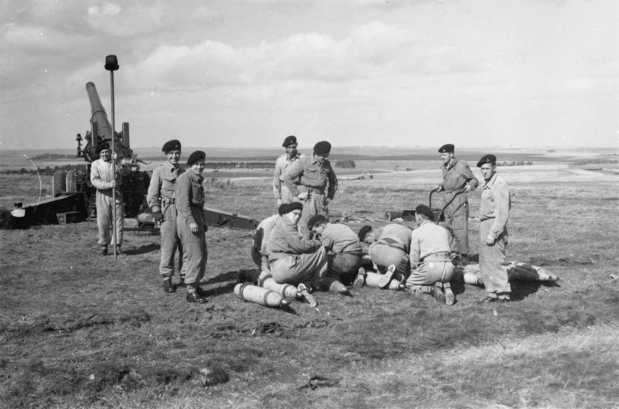 M115 8-inch howitzer 3; gun crew preparing shell for firing. [P1-379-1839]