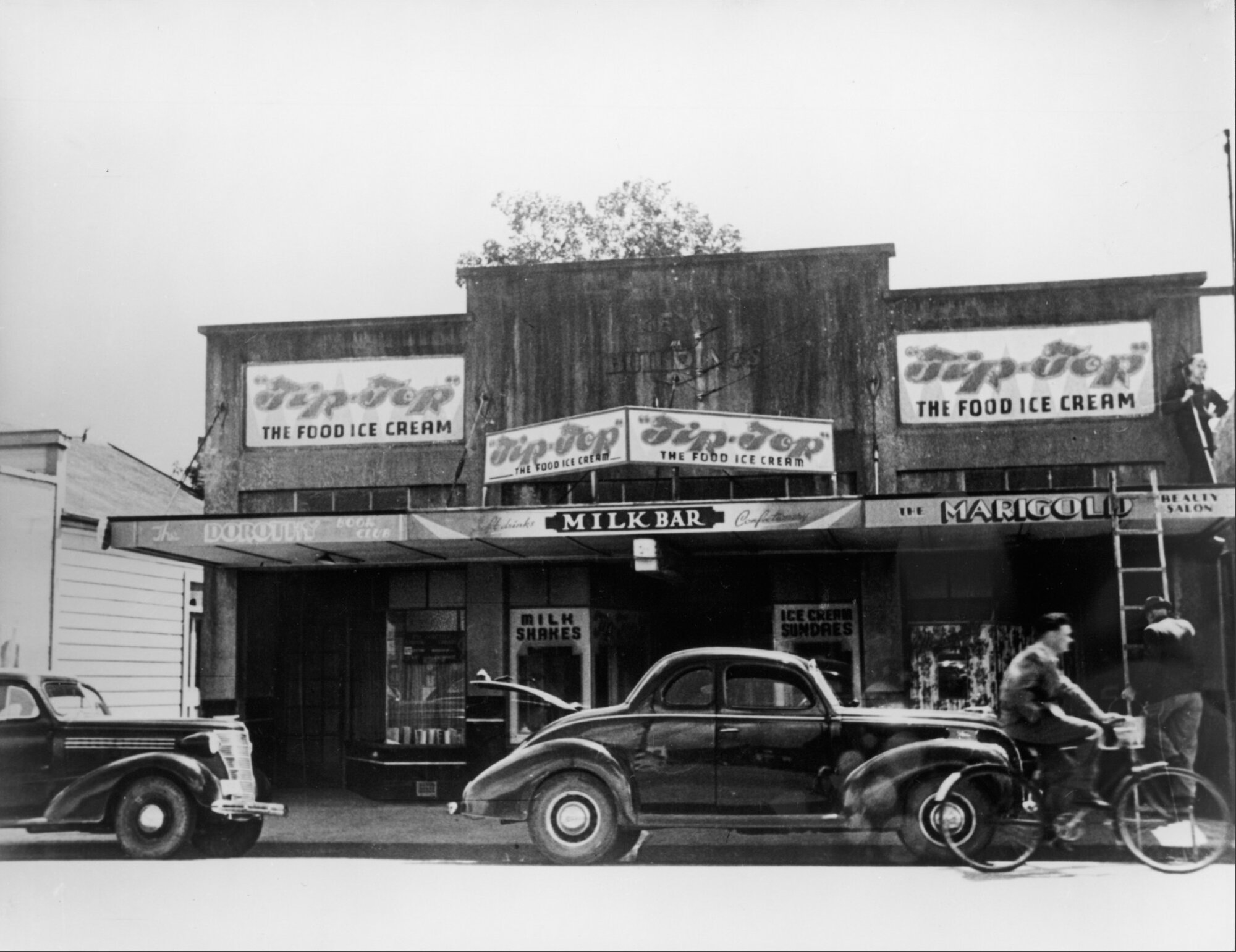 Main St, Upper Hutt, Jan. 1948; north side 06; Dorothy Book Club, milk bar, Marigold beauty salon