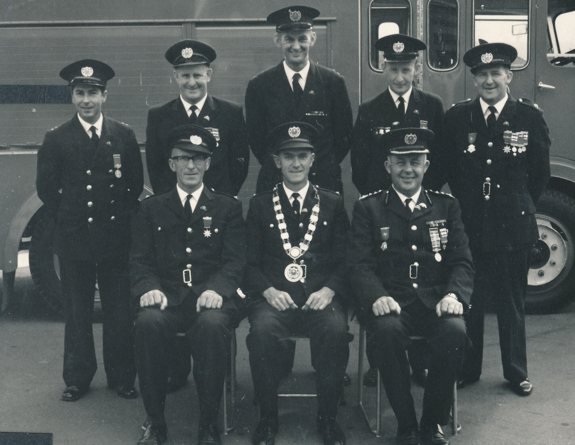 Silverstream Volunteer Fire Brigade group, 1969 or  70; Fred Stringer, centre, as president of Wellingon brigades association, at Upper Hutt Fire Station