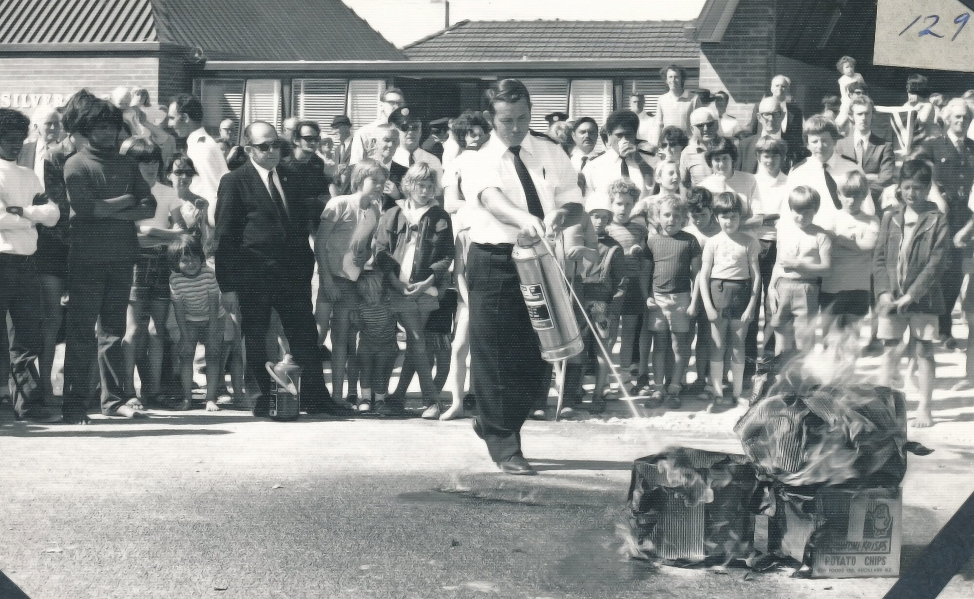 Silverstream Volunteer Fire Brigade; new station opening; November 1974; Mike Day demonstrating a fire extinguisher