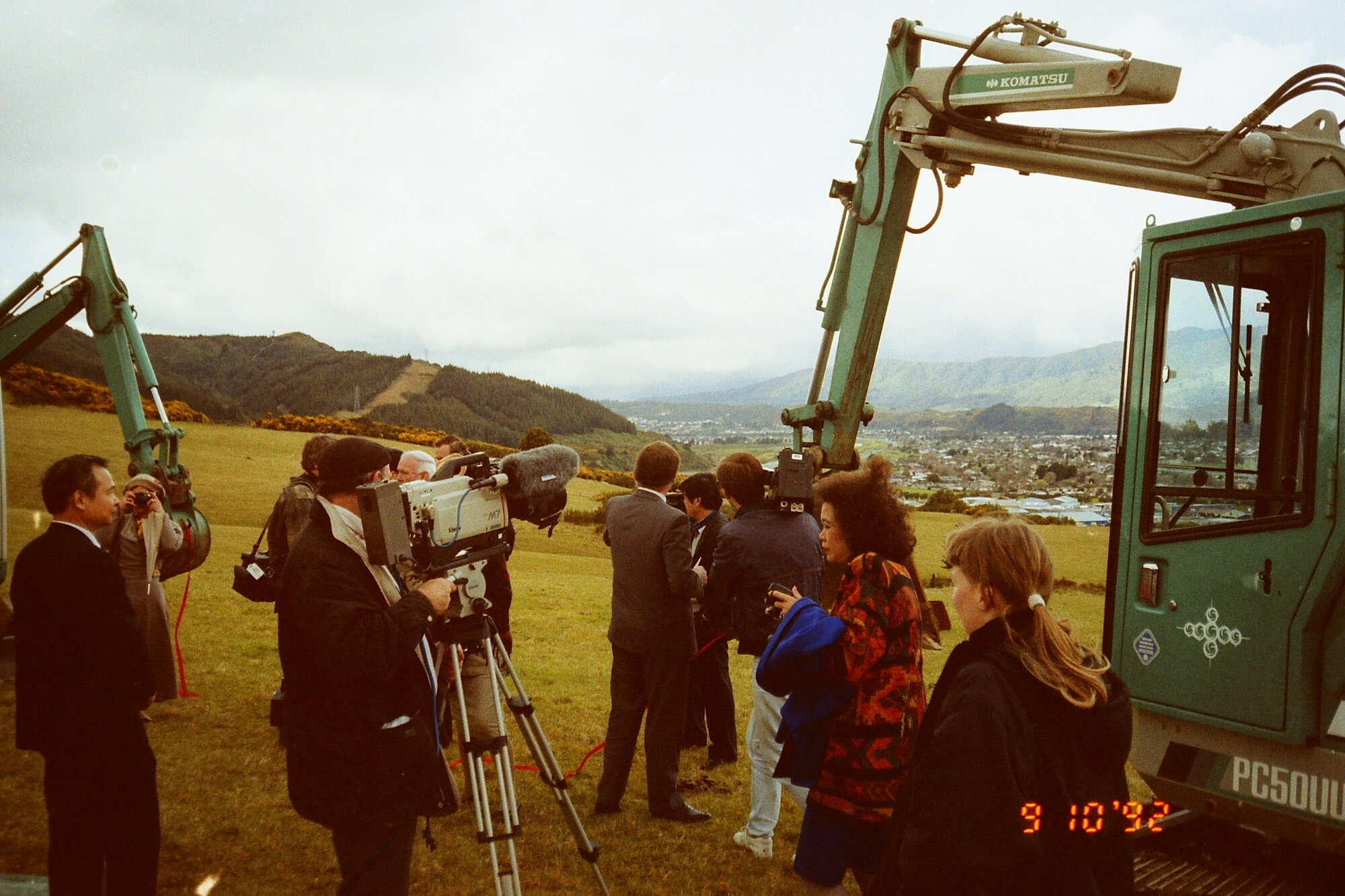 Craig's Flat ground-breaking; excavators and television cameraman.