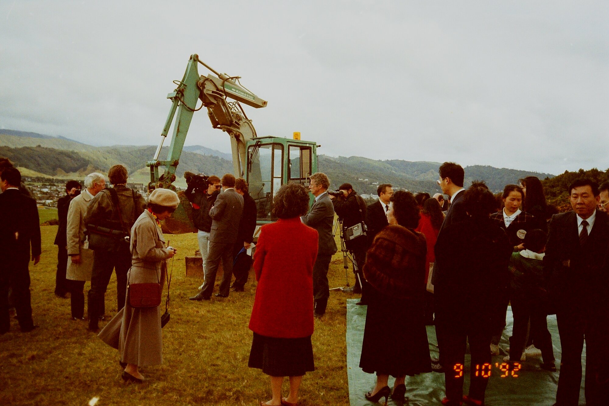 Craig's Flat ground-breaking; crowd and excavator