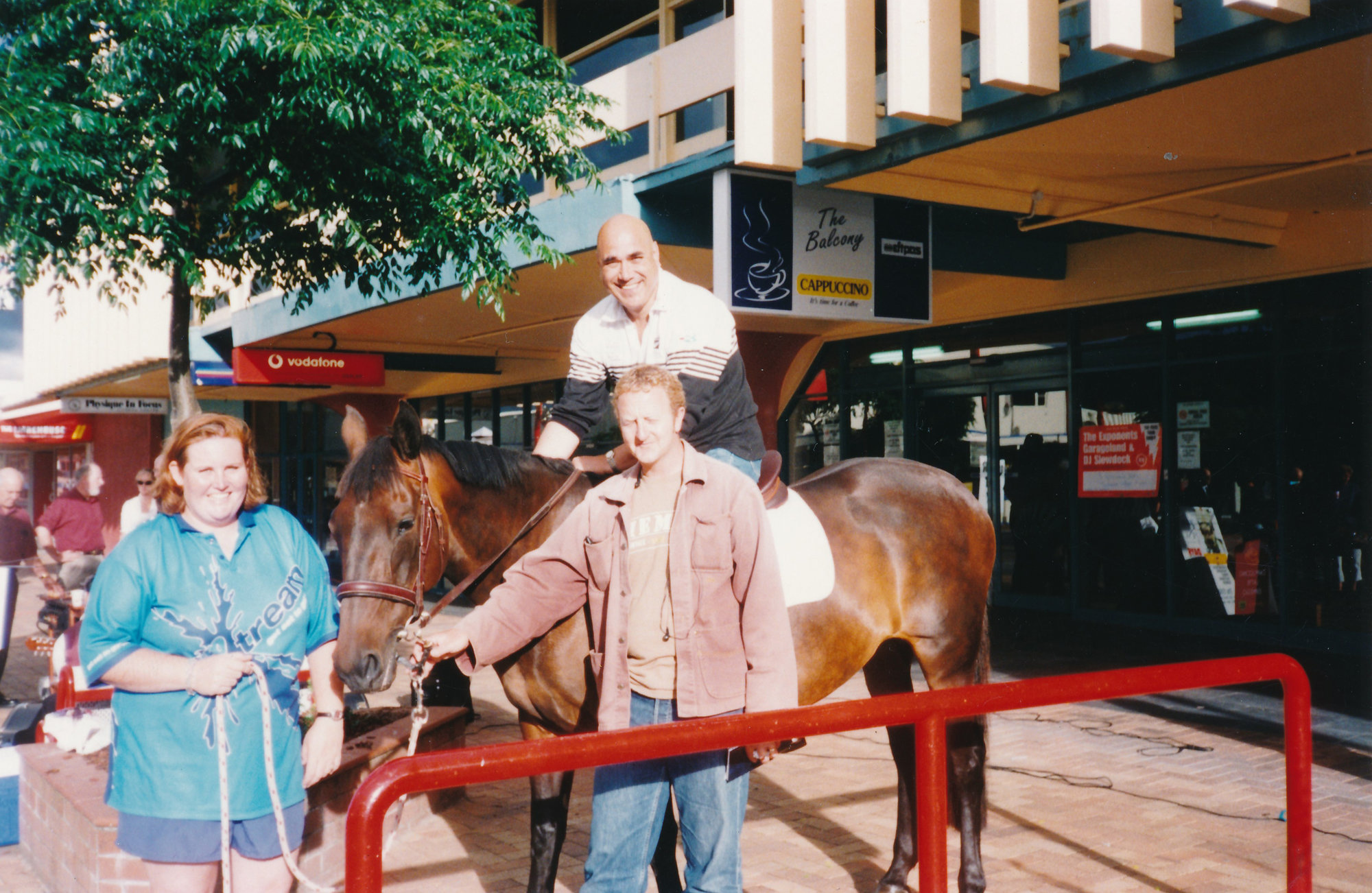 Nick Tansley and Frankie Stevens on a horse; Main Street; ca 2000s