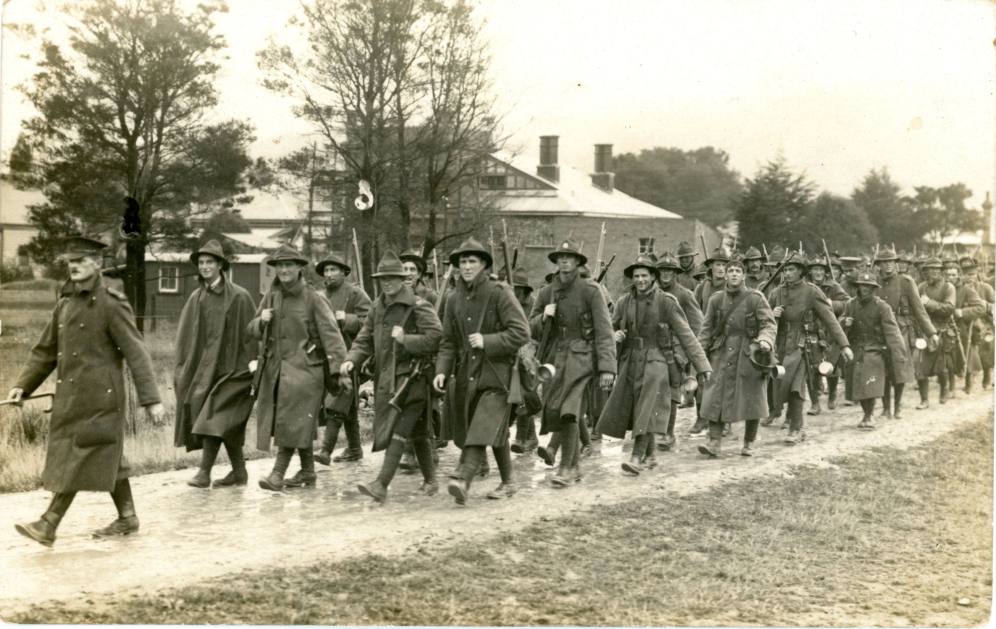 Troops marching through Upper Hutt in the rain, 1916