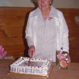 Silver Haven Social Club; 2nd birthday; woman cutting cake.