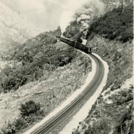 Rimutaka Incline; rear view of passenger train with two Fell locomotives. [P2-15-23]