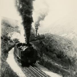 Rimutaka Incline; front view of train ascending with two Fell locomotives. [P2-16-24]