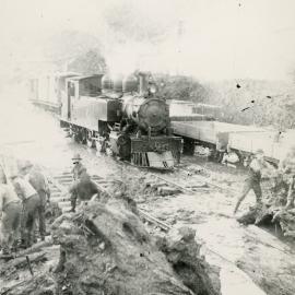 Summit station yard; clearing debris from the tracks. Five men visible.