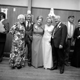 Wallis 25th wedding anniversary  4; couple left of centre. [P1-8829-11219]