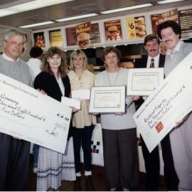 McDonald's; monster cheques; joint winners Kevin Greaney and Richard Fogarty.