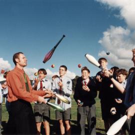 HIBS; jugglers watch teacher Andrew Bowen and Jeremy Harrison passing juggling batons.