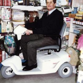 Guppy's pharmacy; owner Wayne Guppy and a Fisher and Paykel electric mobility scooter.