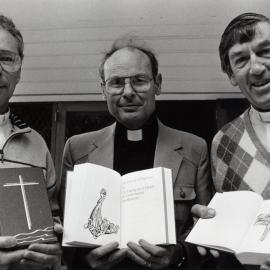 Anglican vicars with the new Prayer Book.