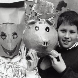 Maoribank School handiwork; Sarah Blake in her mask; Brett Hanrahan with his papier-mache money box.