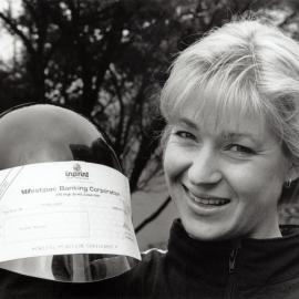 Jacqui Nelson, Olympic cyclist, with $500 cheque presented to her by the Upper Hutt Leader.