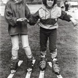 Plateau School; Melissa Sadler, Christina O'Keeffe try out skis before trip to Ruapehu.