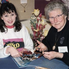 Embroiderers' guild; guest Joan Downes demonstrating lacemaking at Community Gallery exhibition.