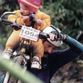 Cycling; Karapoti Classic, 1999; Bill Brierley and his 23-month-old daughter Odette cross the Akatarawa River.