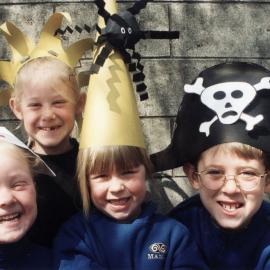 Library; school holiday programme hats; Ellen and Anna Imrie, Rachael Dobson, Todd Imrie.