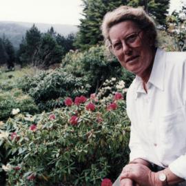 Efil Doog Garden of Art co-owner Shirley Cosgrove and rhododendrons.