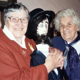 John Golder's grand-daughters present figure of John to the cottage museum.