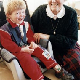 WDFF; child seats presented to Plunket; WDFF president Phyllis McPherson and Callum Anderson, almost 3.