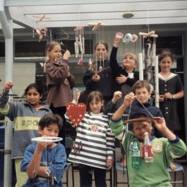 Maoribank School; children from Room One proudly show off their windchimes.