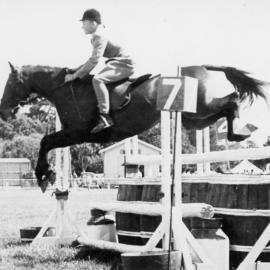 A & P show; horse and rider clearing jump No. 7.