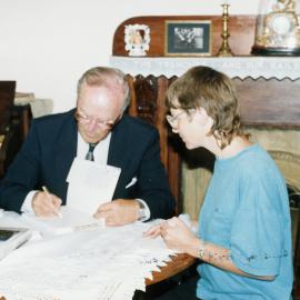 Jack Kelleher signing copies of his book 'Upper Hutt: the History' at Golders Cottage.