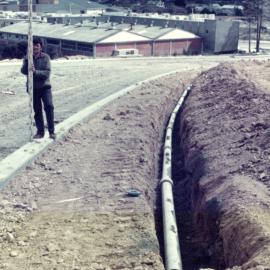 Kingsley Heights 1976 09; first street (King Charles Drive); watermain at chainage 140 metres; J.Kelly, chainman