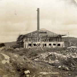 Dunlop factory building construction; boiler-house from the east; chimney nearing completion.